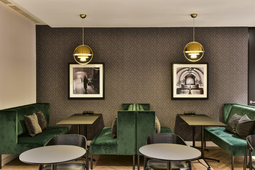 288 Bishopsgate Lounge Area with Green Sofas, Tables and Chairs